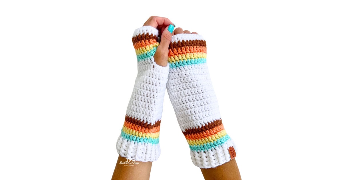 Handmade crochet arm warmers with colorful retro stripes in brown, orange, yellow, mint, and white. Free fingerless gloves pattern for beginners.