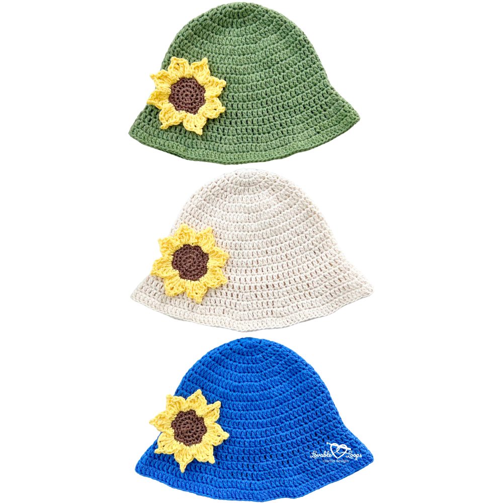 Green, cream, and blue crochet bucket hats displayed vertically, each with a yellow sunflower applique. Beginner-friendly crochet sunflower bucket hat pattern.