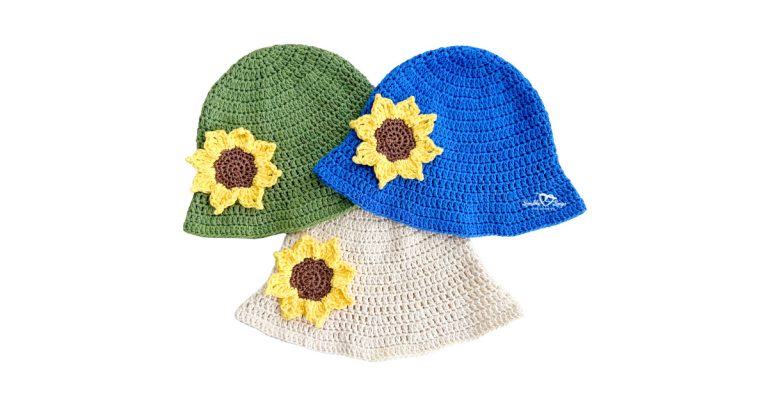 Three crochet bucket hats with sunflower appliques in green, blue, and cream colors. Handmade sunflower crochet hat pattern with classic sloped brim, worked in double crochet stitches.