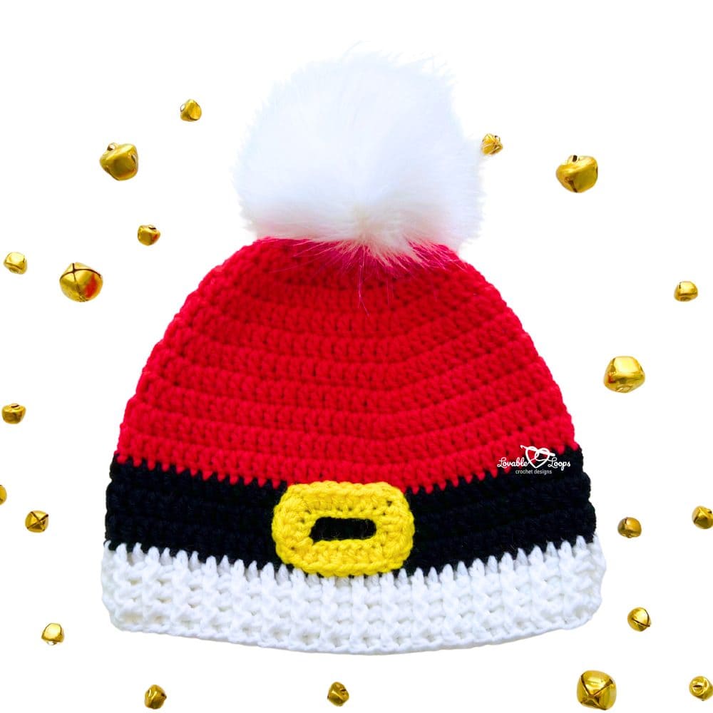 Free crochet pattern graphic featuring a festive Santa beanie with belt buckle detail, ribbed brim, and pom pom, surrounded by gold jingle bells.