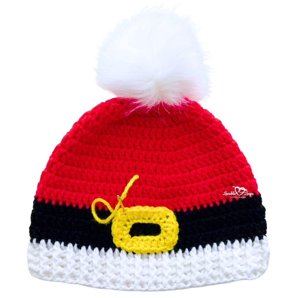 Handmade crochet Santa beanie in red with black stripe, yellow buckle, ribbed white brim, and pom pom on top.