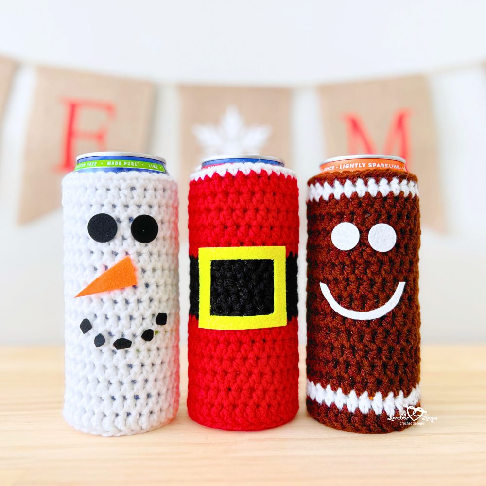 Handmade holiday crochet cozy pattern with three designs: a Snowman crochet cozy pattern in white with felt details, a Santa crochet cozy pattern with a belt buckle, and a Gingerbread man crochet cozy pattern with a smiling face. A festive crochet drink cozy pattern for Christmas.
