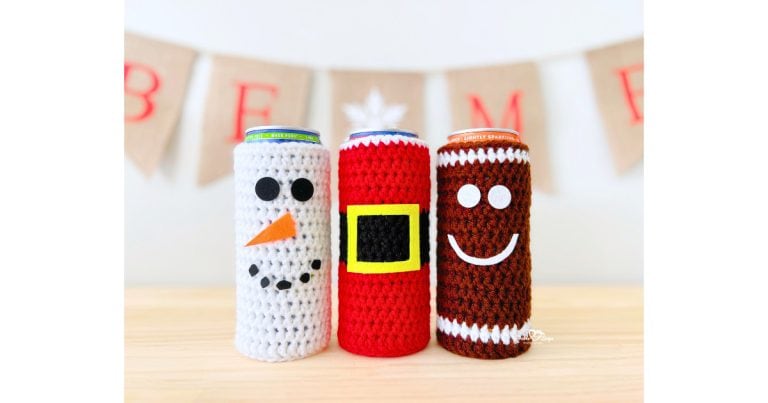 Handmade Christmas crochet cozy pattern featuring three festive designs: a Santa crochet cozy pattern with a yellow belt buckle, a Snowman crochet cozy pattern with a carrot nose and black felt eyes, and a Gingerbread man crochet cozy pattern with a white smile. Perfect holiday crochet cozy pattern for slim cans, gifts, parties, or craft fairs.