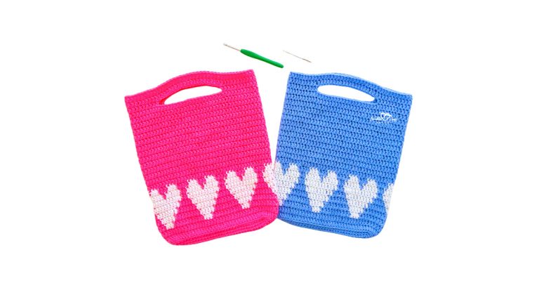 Wide header image featuring pink and blue heart motif crochet totes with a hook and yarn needle; free crochet heart bag pattern with simple colorwork.