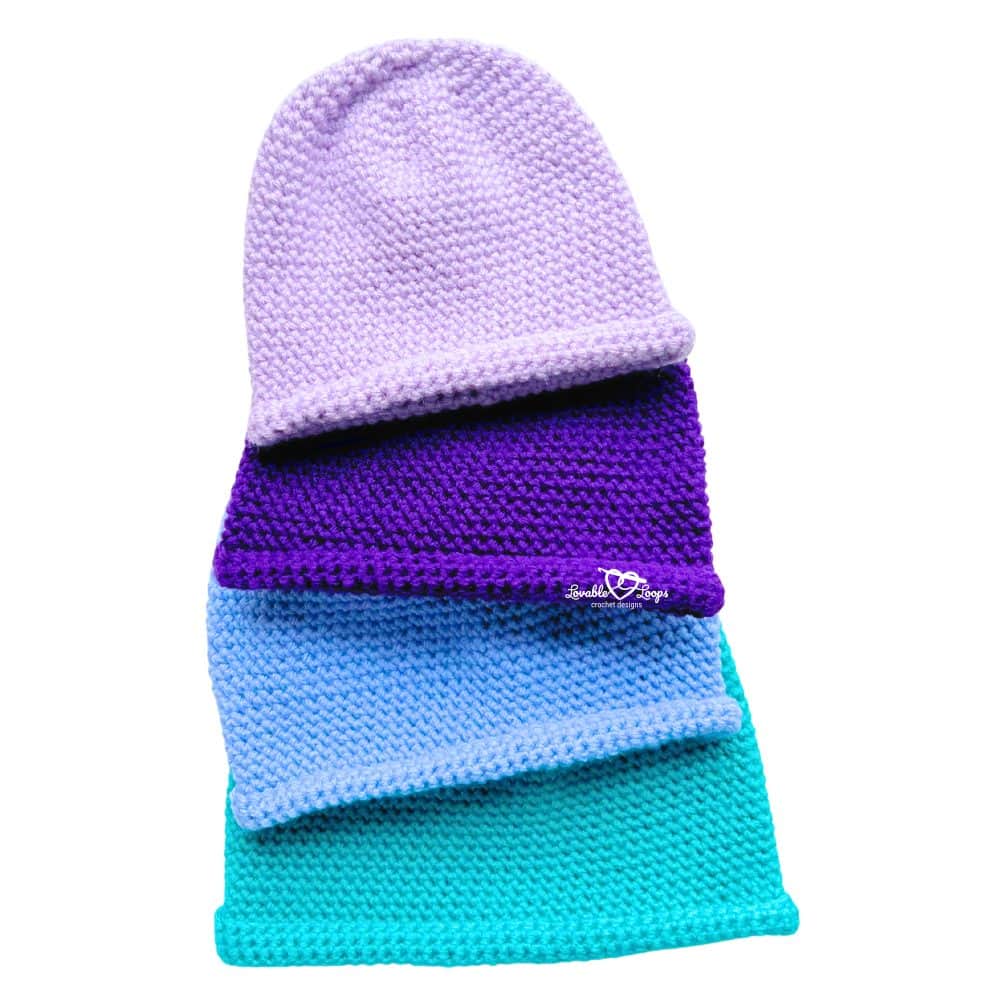 Four single crochet beanies stacked in a column—lavender, purple, blue, and teal—displaying the smooth texture and rolled brim from a free easy single crochet beanie pattern.