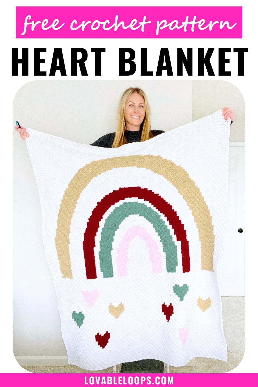 Handmade crochet heart blanket featuring a large boho-style rainbow with hearts falling below it, made using the C2C crochet technique. Free crochet heart blanket pattern.