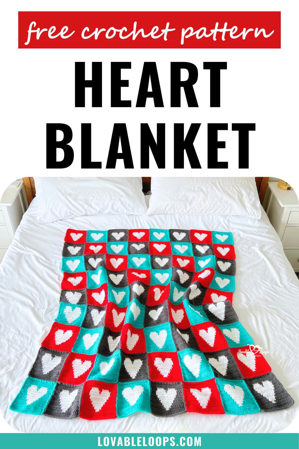 Top-down view of a finished crochet heart blanket made from individual heart squares in red, teal, and gray.