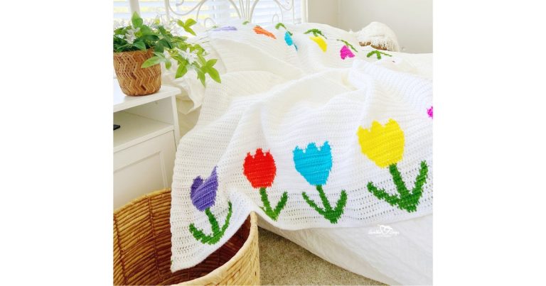 Crochet flower blanket pattern with bright tulips made using tapestry crochet and double crochet stitches