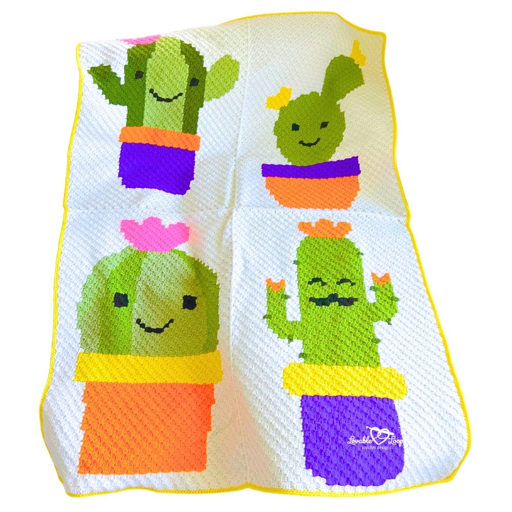 Close-up of a C2C crochet cactus blanket showing textured diagonal stitches and four cartoon-style cactus plants in vibrant pots with smiling faces and decorative details.