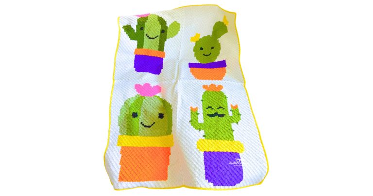 Corner-to-corner C2C crochet cactus blanket featuring four playful cactus designs in colorful pots, including smiling cactus faces and bright pink, orange, purple, and yellow accents on a white blanket with yellow border.