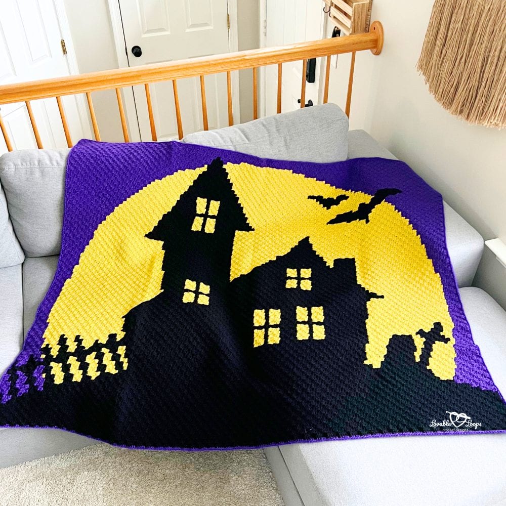 C2C haunted house blanket crochet pattern featuring a spooky house silhouette, bats, and full moon design