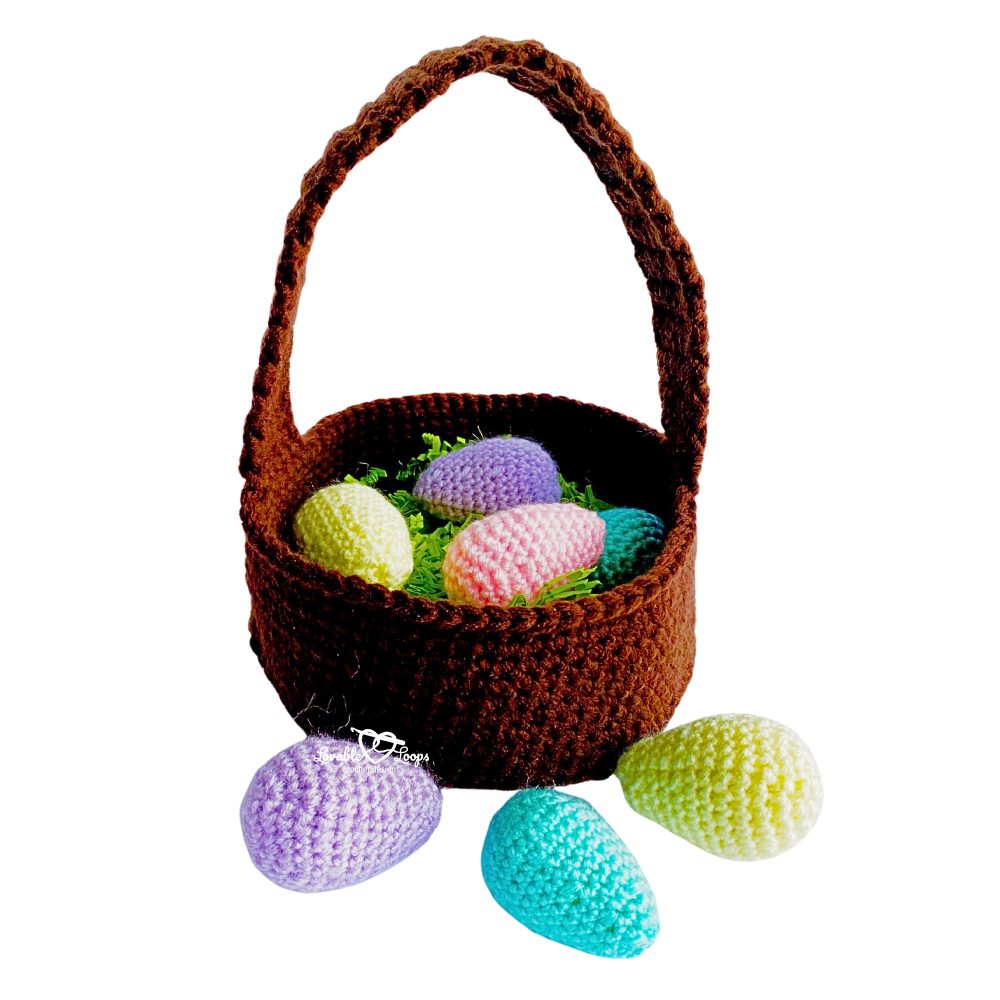 Free crochet Easter basket pattern with sturdy handle, shown filled with colorful crochet Easter eggs and styled for kids Easter decor