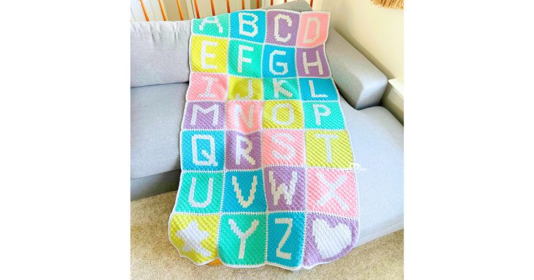 Crochet alphabet blanket pattern featuring colorful A&ndash;Z letter squares made with corner-to-corner crochet, shown on a couch