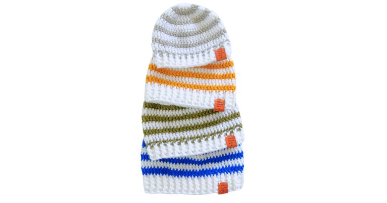 Stacked crochet beanie hats showing the same beginner-friendly crochet beanie hat pattern in baby, toddler, child, and adult sizes with colorful stripes and a ribbed brim