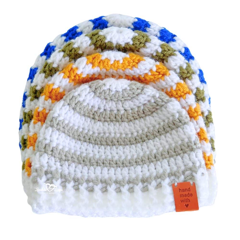 Striped crochet beanie hat made with worsted weight yarn, featuring a ribbed brim and top-down construction