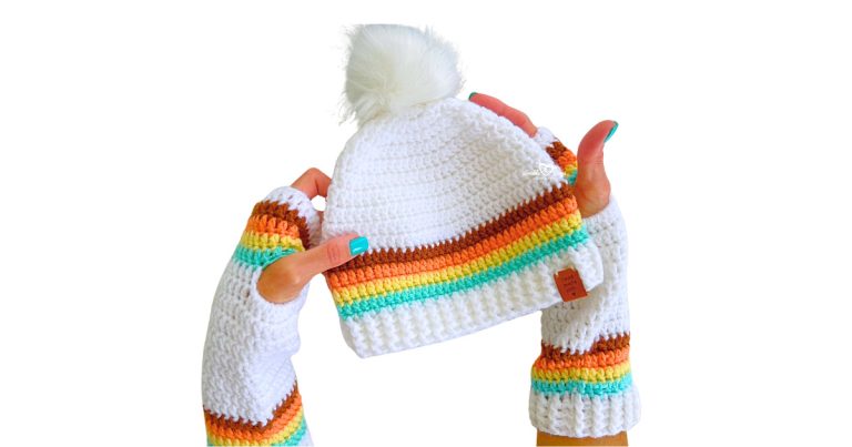 Crochet beanie with pom pom and matching crochet arm warmers in a retro color palette, designed for teens and adults