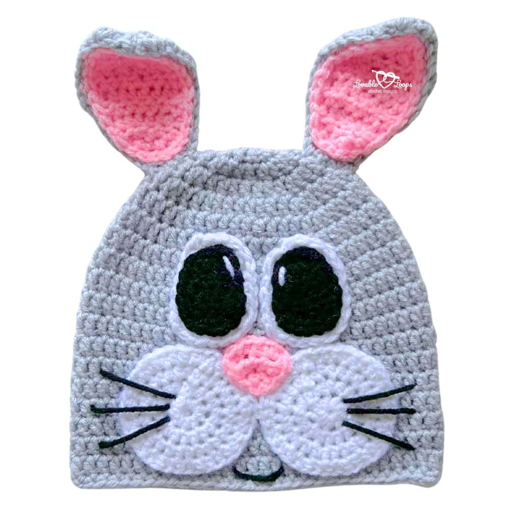 Finished crochet bunny hat pattern with upright ears and a cute bunny face