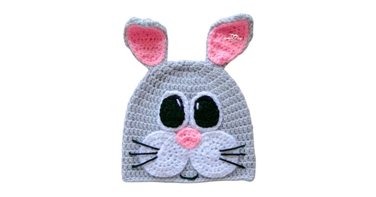 Crochet bunny hat pattern with upright ears and a bunny face, made with worsted weight yarn for a spring crochet project