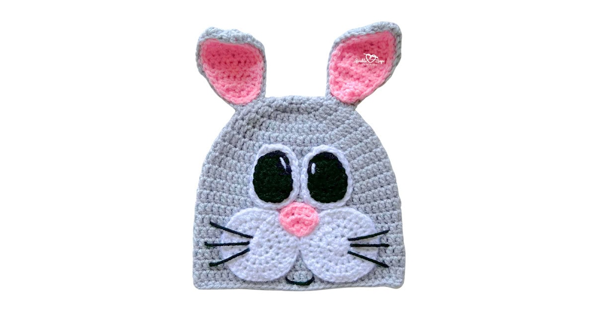 Crochet bunny hat pattern with upright ears and a bunny face, made with worsted weight yarn for a spring crochet project