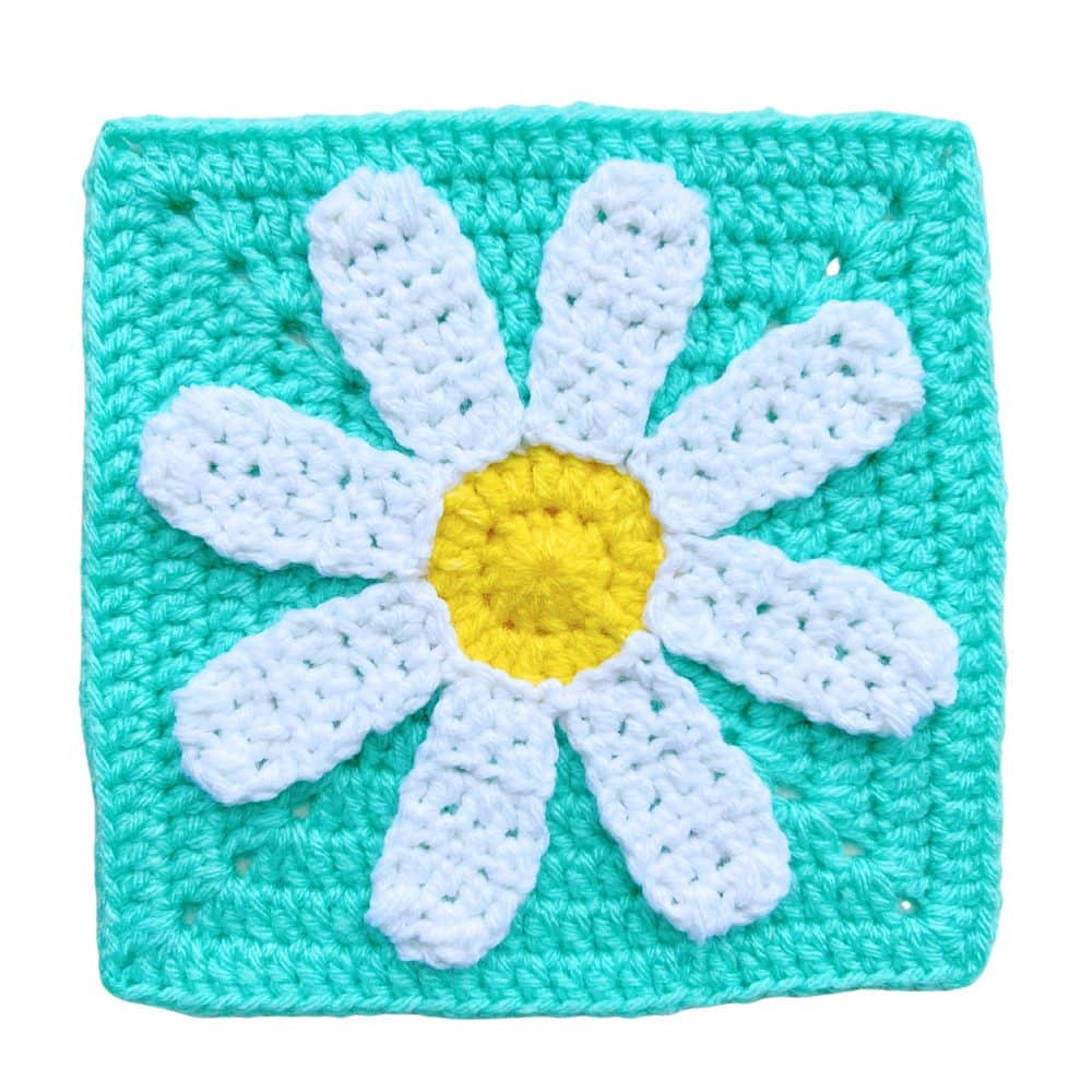 Floral crochet granny square pattern with a textured daisy design, perfect for spring crochet projects