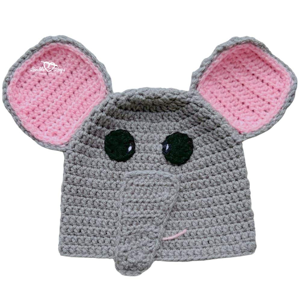 Cute gray crochet elephant beanie with oversized ears, a soft trunk, and a simple animal face design.