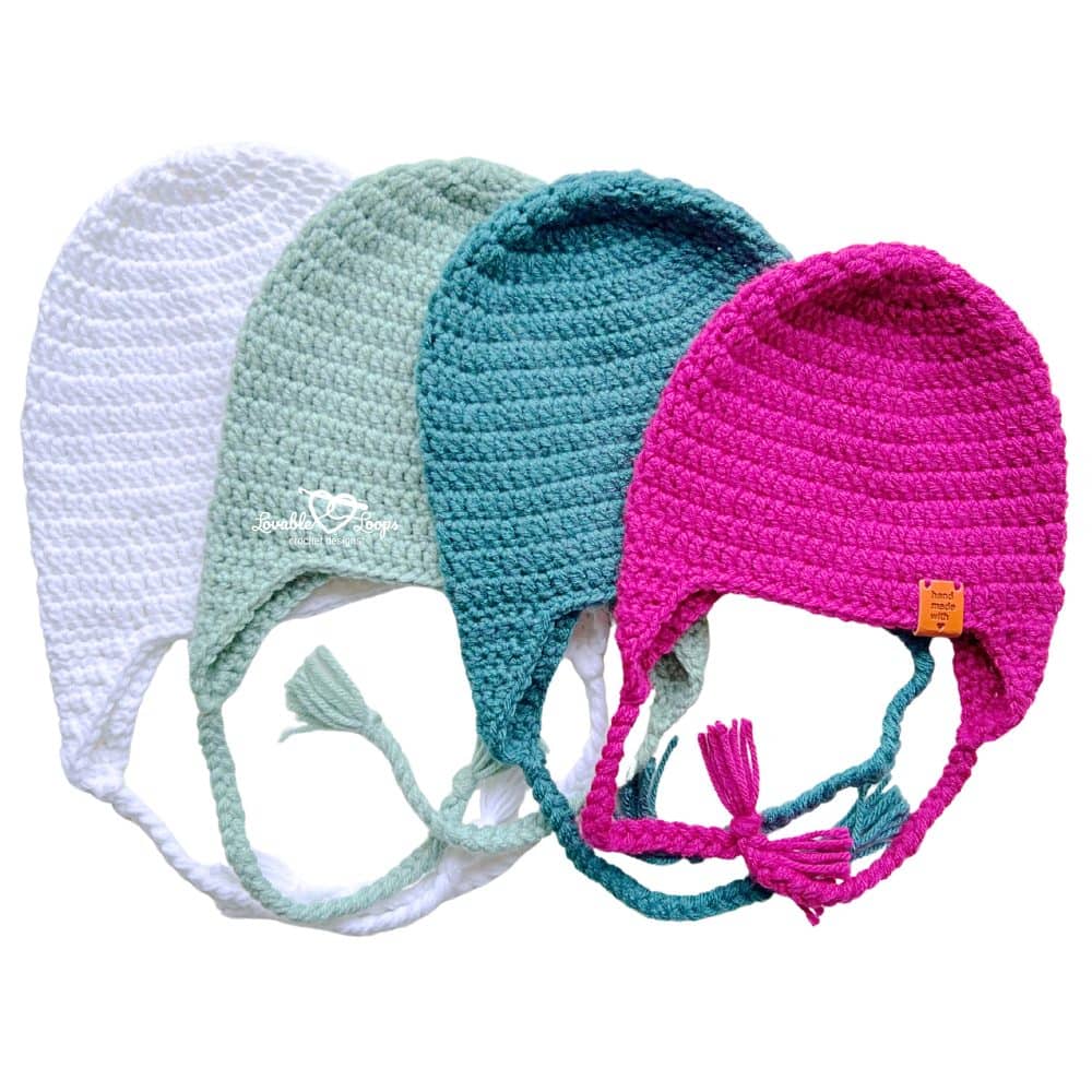 Crochet hat with ear flaps made in white, sage green, teal, and pink, showing a free crochet ear flap hat pattern for baby, toddler, child, and adult sizes