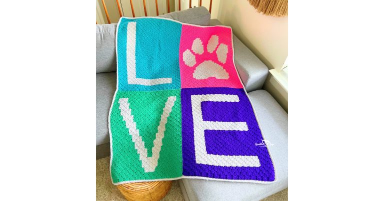 Crochet love paw print blanket pattern made with the corner-to-corner technique, featuring a colorful C2C pet blanket design with a paw print and the word love