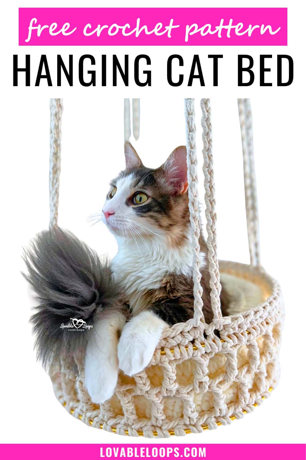 Cat sitting in a modern hanging crochet cat bed made with super bulky rope yarn and metal hoops, featuring a neutral boho design and elevated hammock-style structure.