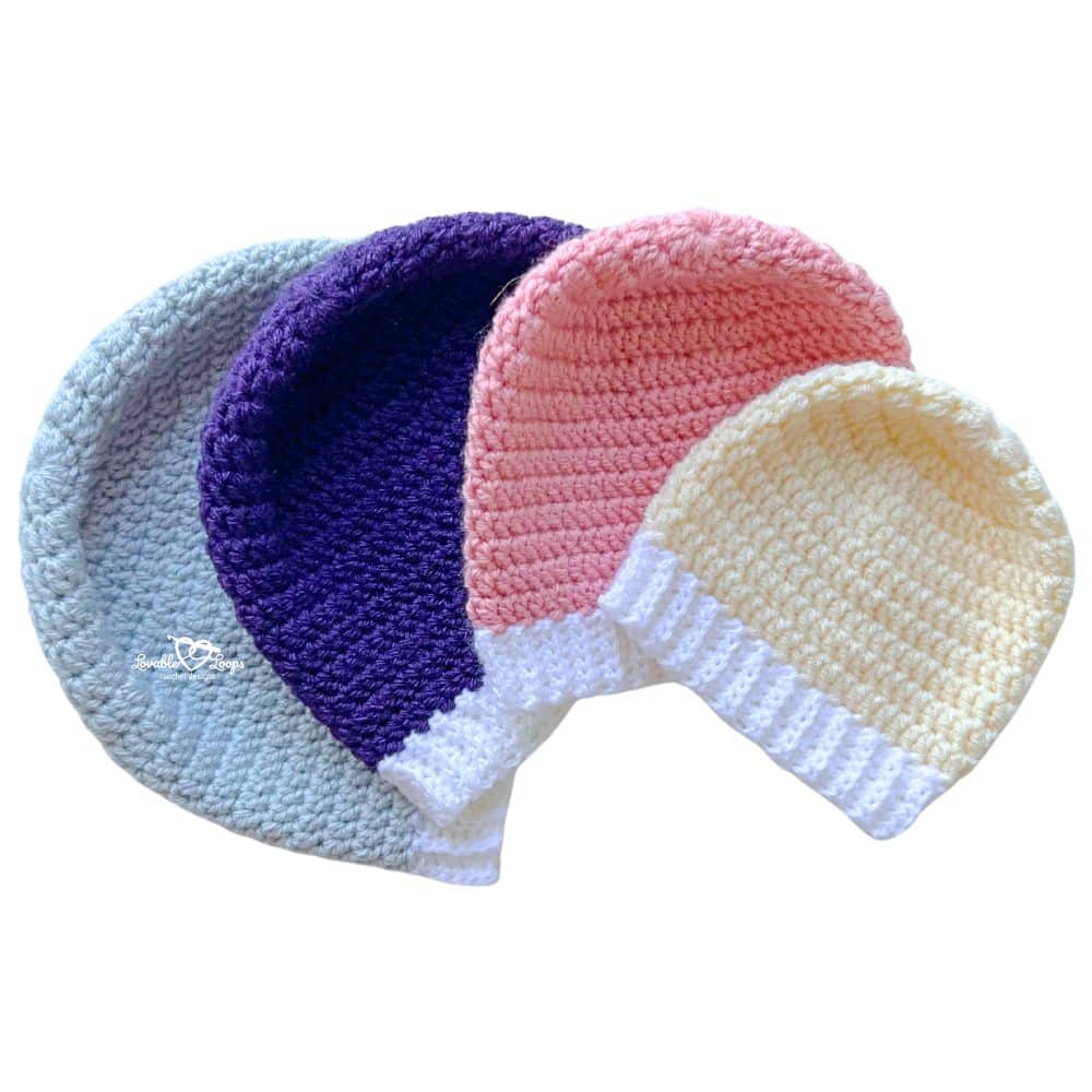 Free and easy how to crochet a beanie cover image with four finished crochet beanies in baby, toddler, child, and adult sizes.