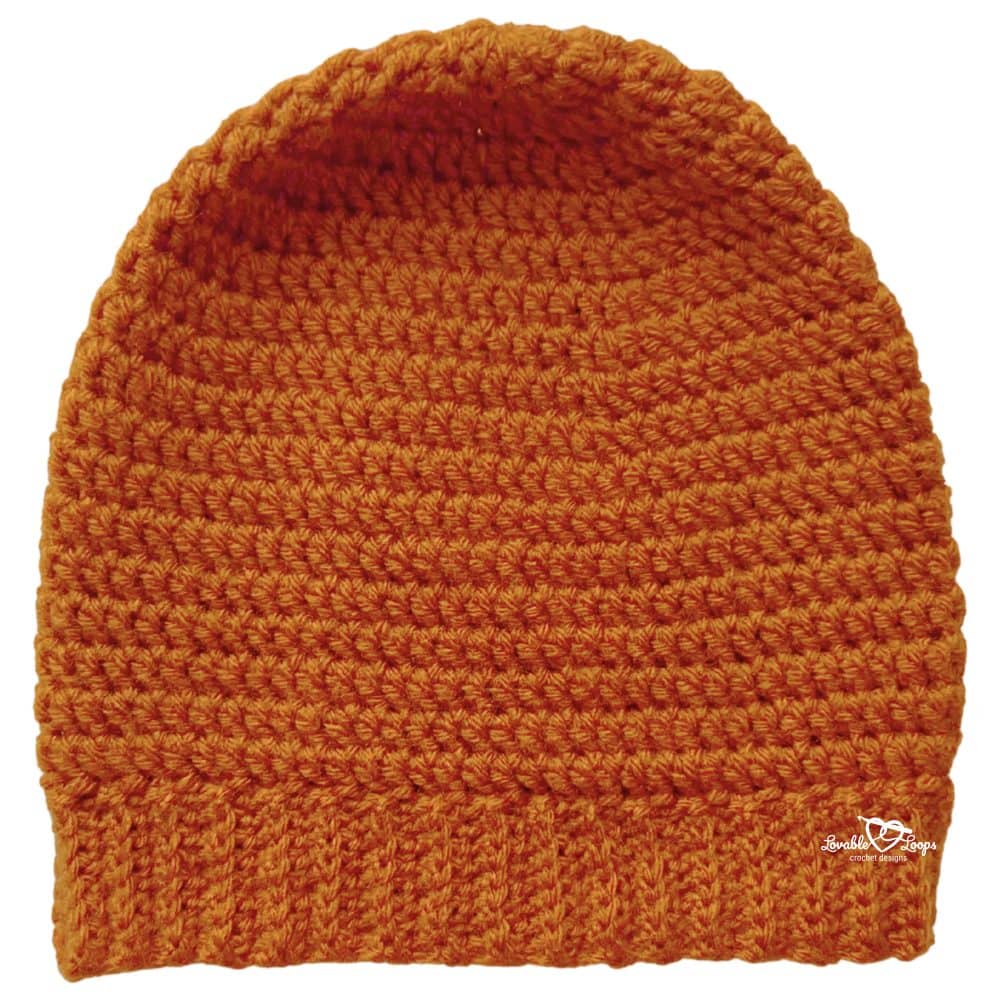 Finished men&rsquo;s crochet hat in burnt orange yarn with textured stitches and a ribbed brim, worked top down in the round.