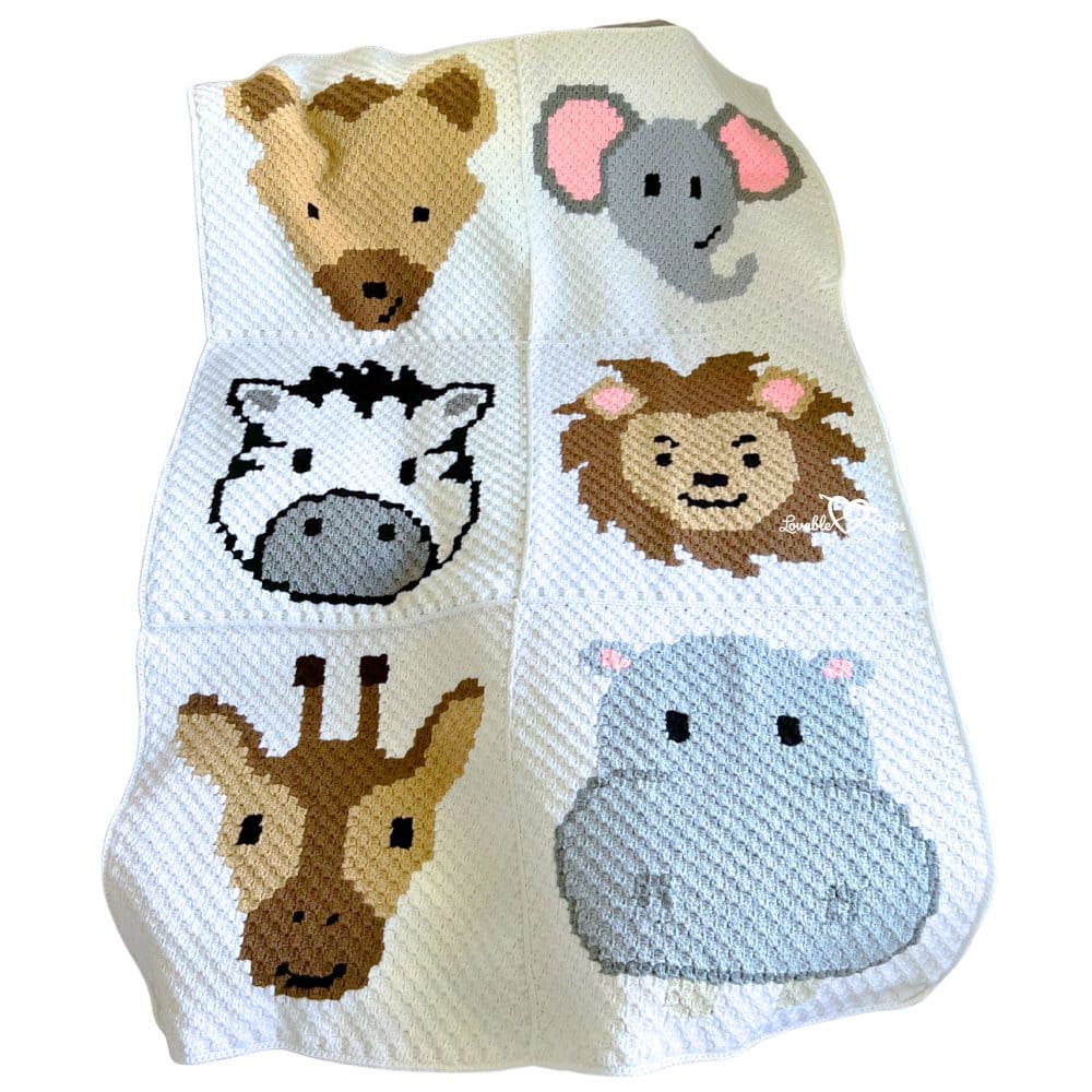 Close view of a C2C crochet safari baby blanket with six jungle animals including giraffe, lion, elephant, zebra, hippo, and bear arranged in square panels.