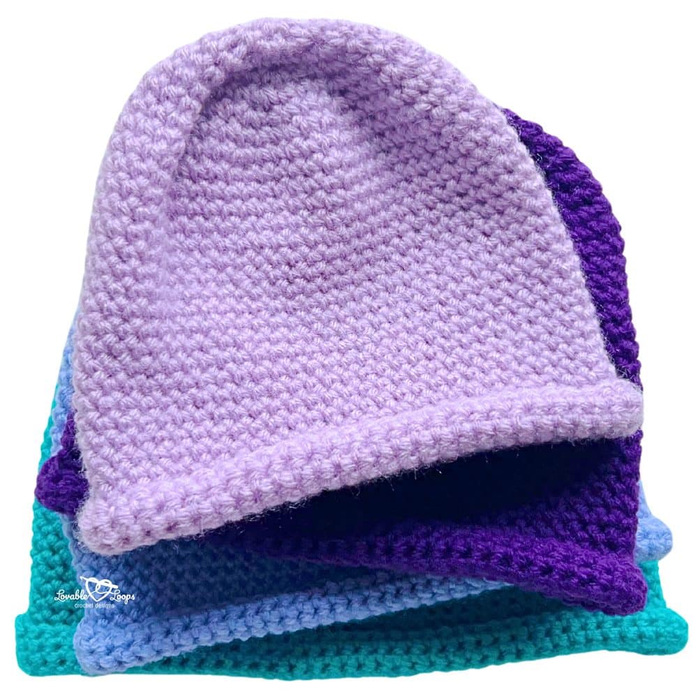 Single crochet beanie pattern showing rolled brim and smooth stitch texture in multiple colors