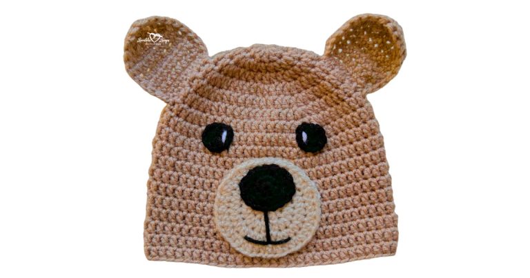 Wide featured image of a brown crochet bear hat with round ears, black eyes, and a cream snout, displayed on a light gray background.