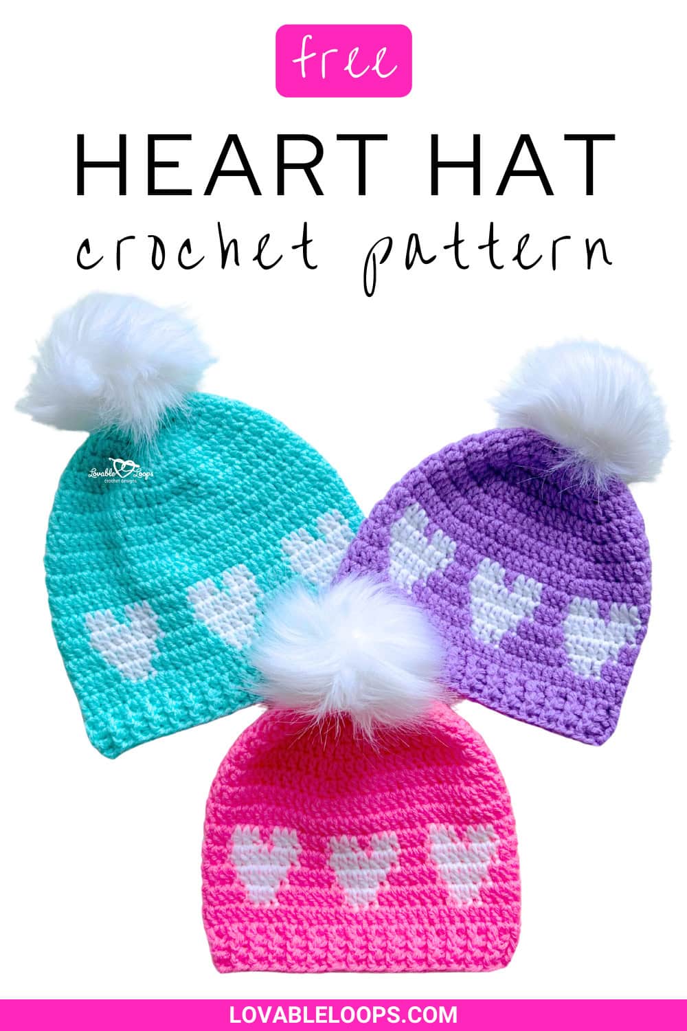 Three colorful crochet heart hats with white pom poms on top. Free crochet heart hat pattern featuring rows of hearts, ribbed brim, and Valentine&rsquo;s Day design in toddler, child, and adult sizes