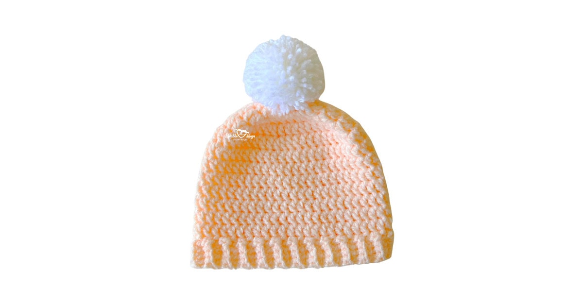 Easy crochet toddler hat pattern worked top down with bulky yarn and a stretchy ribbed brim