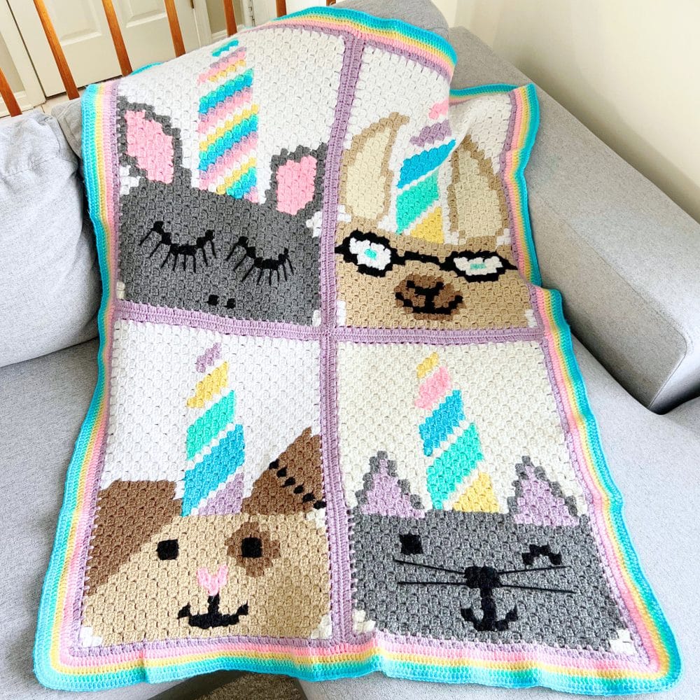 C2C unicorn animal crochet blanket pattern showing four sewn panels and a colorful border for a baby or kids blanket