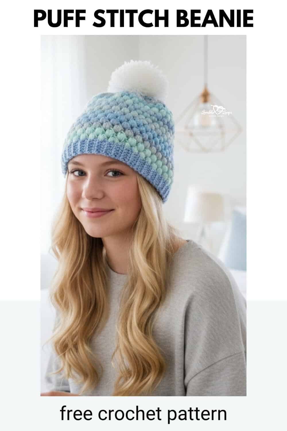 Teen girl wearing a blue, mint, and gray puff stitch crochet beanie with a white pom pom, with text that says &ldquo;PUFF STITCH BEANIE&rdquo; and &ldquo;free crochet pattern.&rdquo;