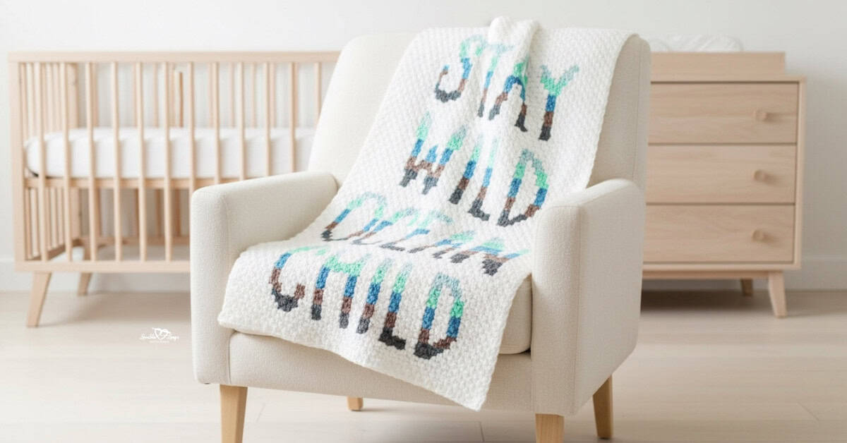 C2C crochet word blanket with the phrase &ldquo;Stay Wild Child&rdquo; draped over a cream armchair in a bright nursery.