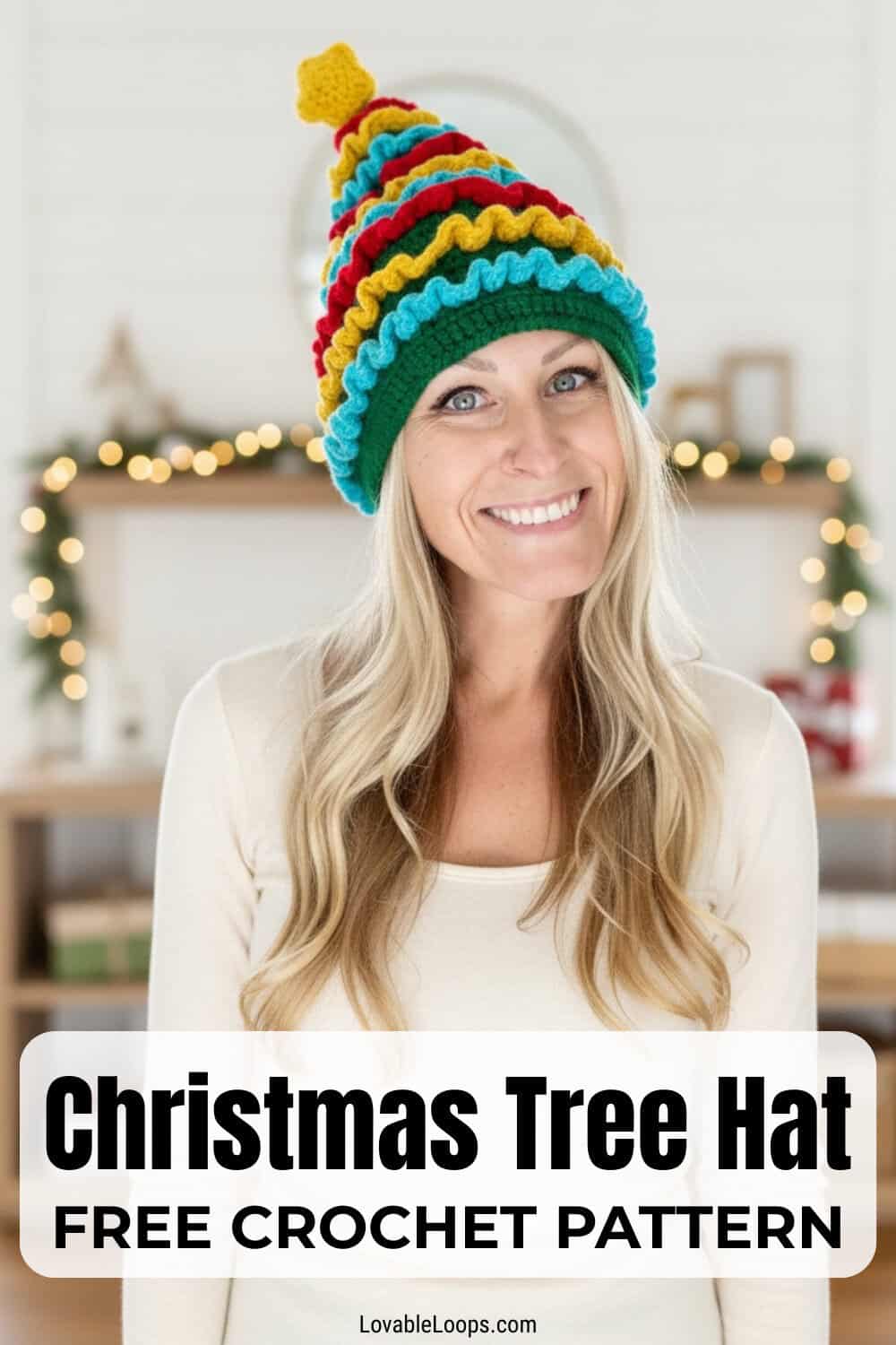 Woman wearing a colorful crochet Christmas tree hat in a bright living room with soft holiday lights and text overlay that reads Christmas Tree Hat free crochet pattern