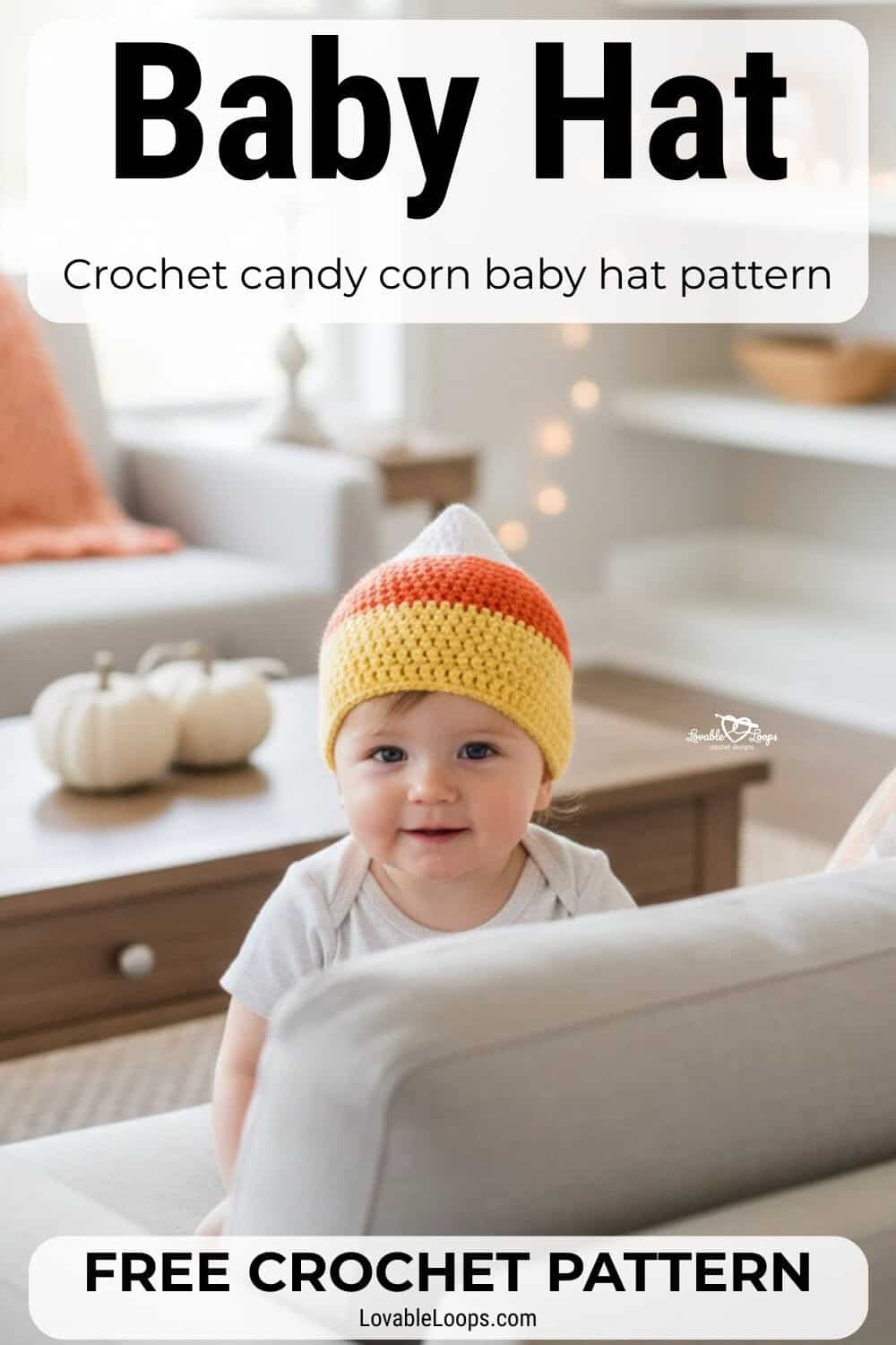 Baby wearing a crochet candy corn hat in white, orange, and yellow while peeking over a couch in a cozy fall living room