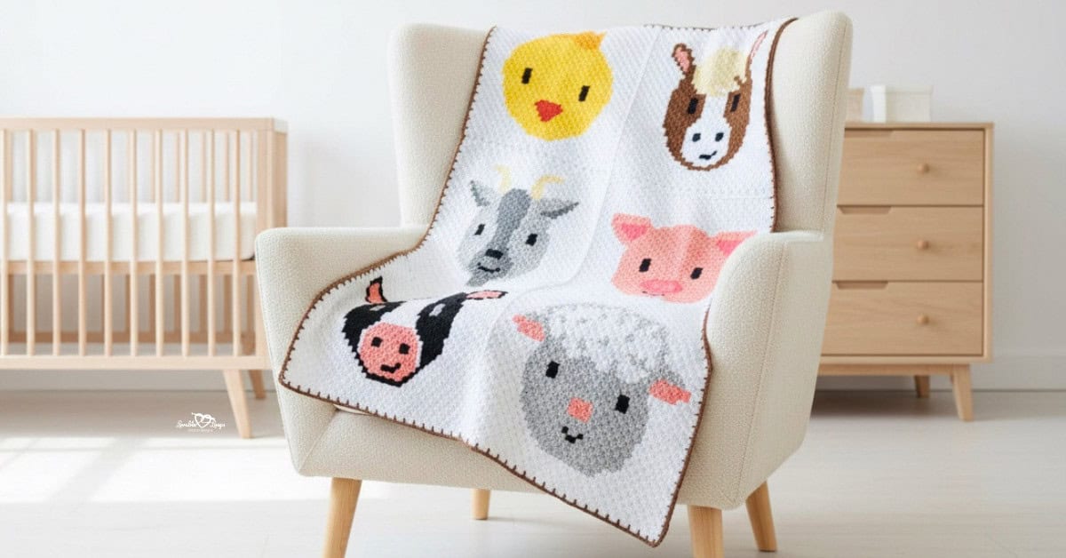C2C crochet farm animal blanket with chick, donkey, goat, pig, cow, and sheep panels draped over a cream armchair in a bright nursery.