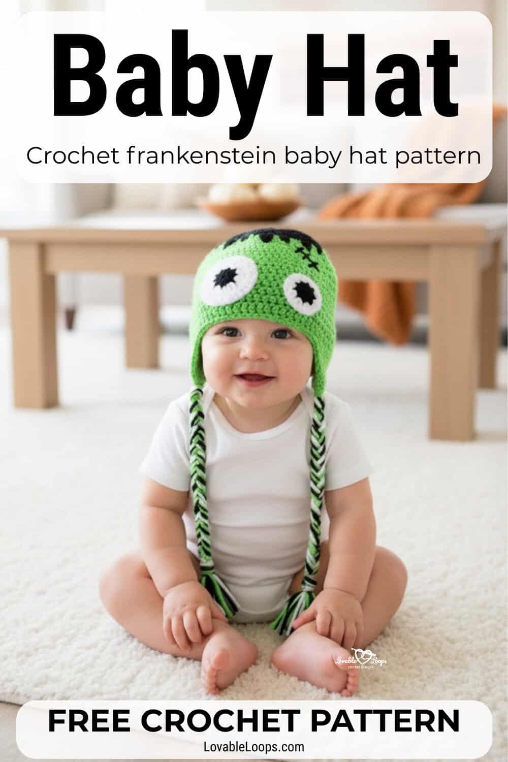 Baby wearing a green crochet Frankenstein hat with monster face details while sitting on a soft rug in a cozy living room