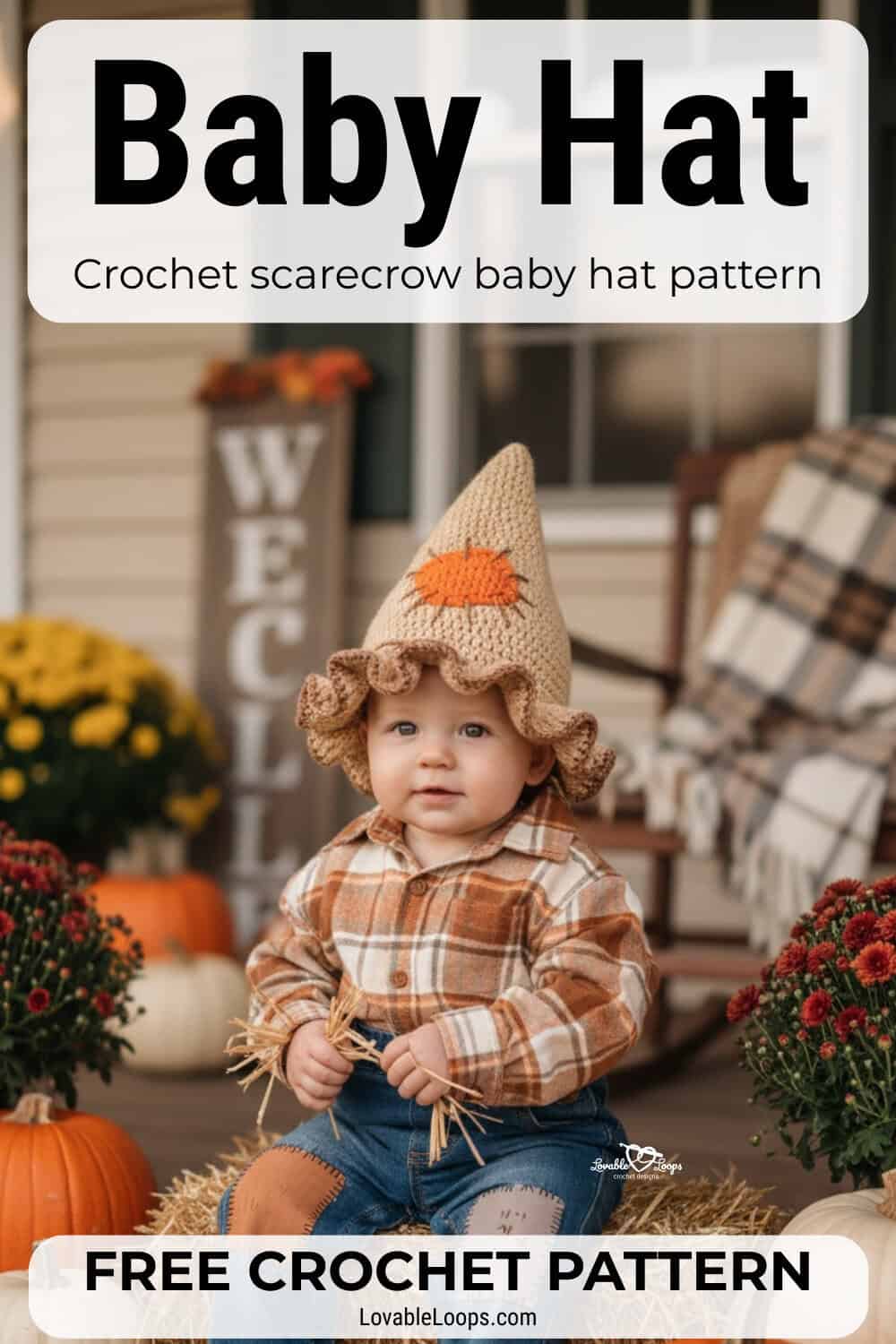 Baby wearing a crochet scarecrow hat with a ruffled brim and patch detail while sitting on a hay bale on a fall porch with pumpkins and mums
