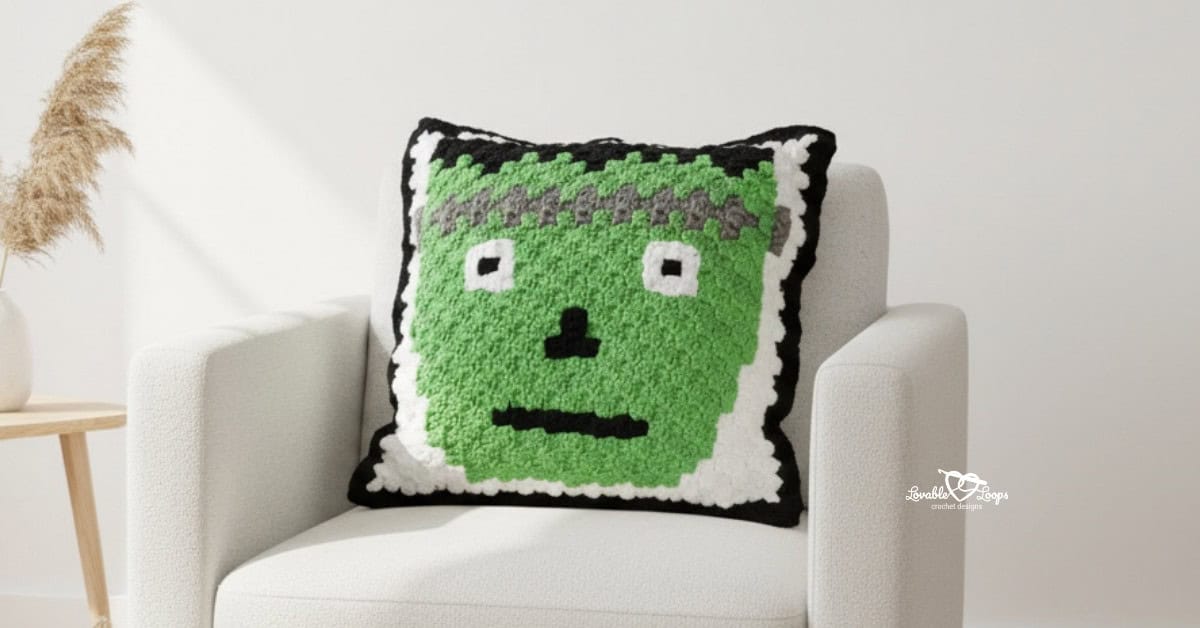 Frankenstein crochet pillow on a white armchair with simple neutral decor.