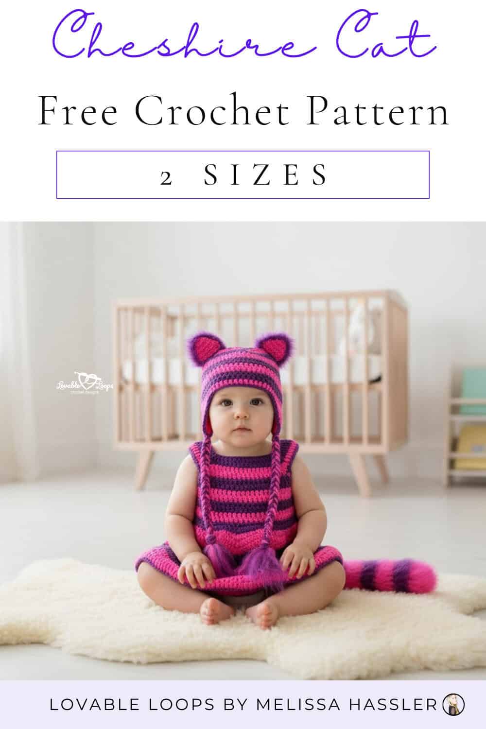 Baby sitting on a white rug wearing a pink and purple striped crochet Cheshire cat costume with a matching earflap hat and striped tail.