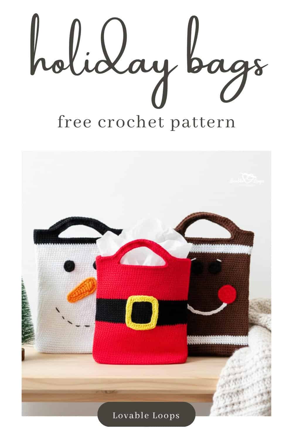 Three crochet Christmas gift bags on a light wood table, including a snowman bag, Santa suit bag, and gingerbread face bag, styled with tissue paper in the center bag and a soft neutral holiday setting.