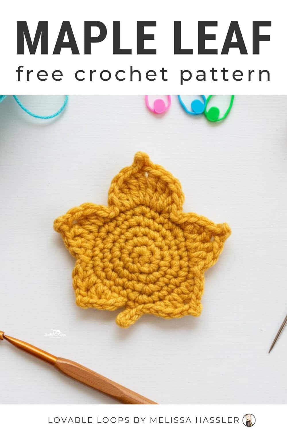 Maple leaf crochet pattern displayed on a bright white desktop with a golden crochet maple leaf and simple craft tools around it.