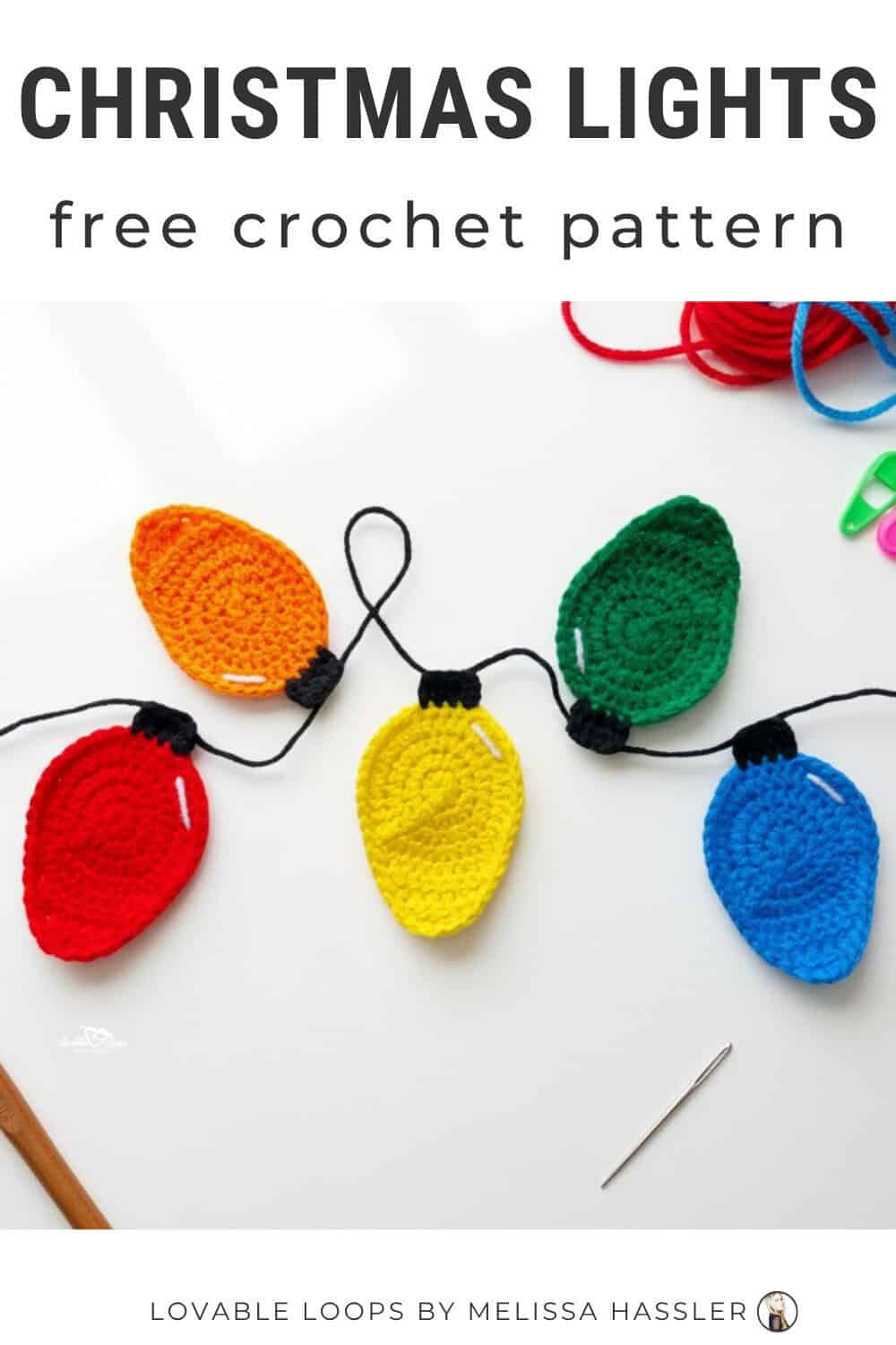 Christmas lights crochet pattern displayed on a bright white desktop with colorful crochet light bulb appliques strung together and simple craft tools around them.