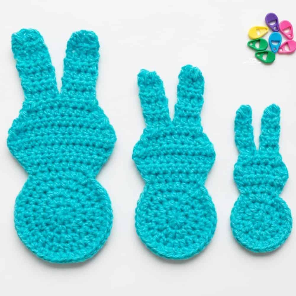 Three crochet Peeps bunny appliques in bright turquoise yarn shown in three different sizes on a white background.
