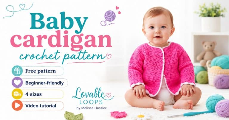 Baby sitting on a cream rug in a nursery, wearing a bright pink crochet cardigan with white edging.
